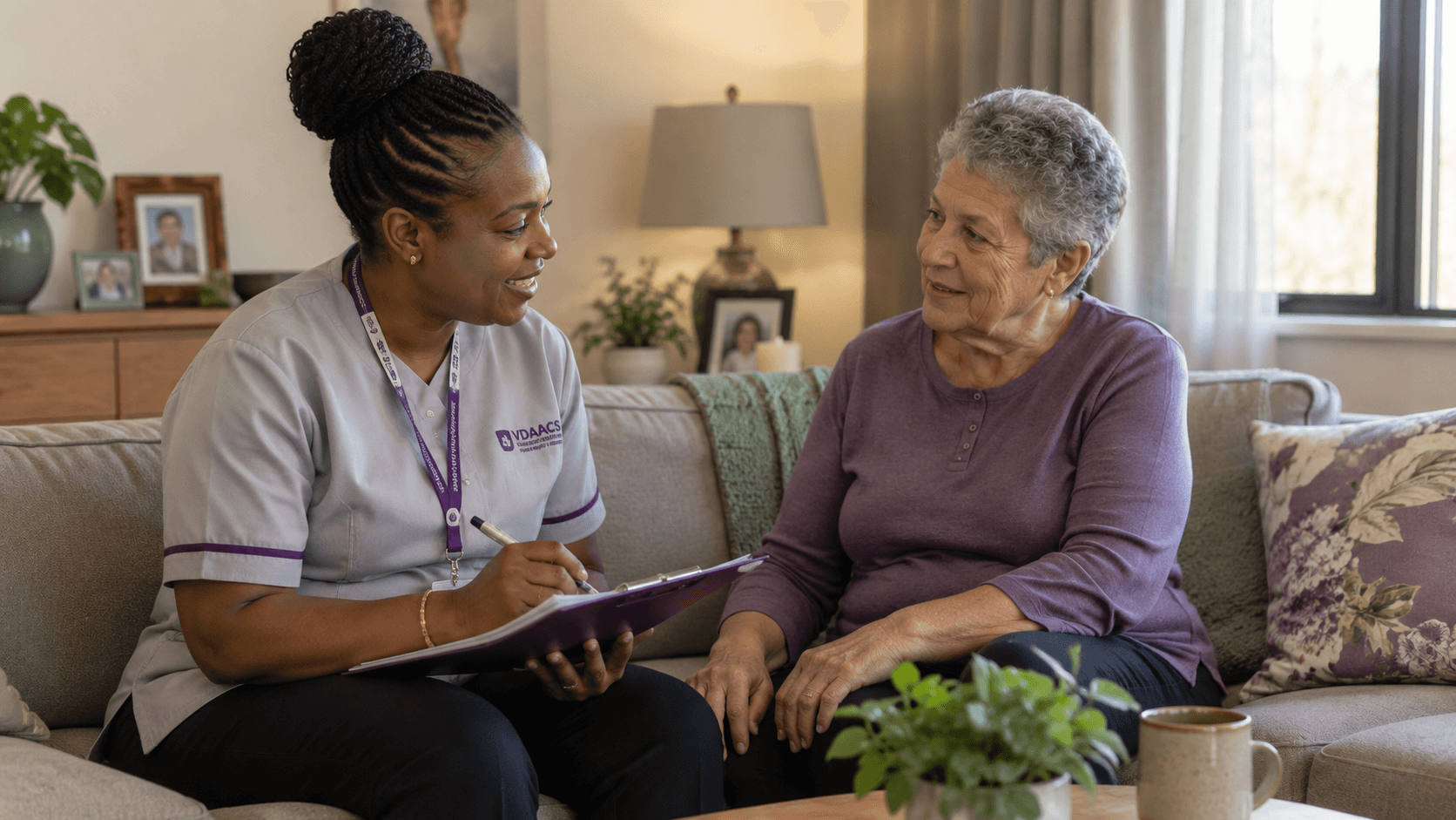 A VDAACS nurse reviewing care with an older woman at home