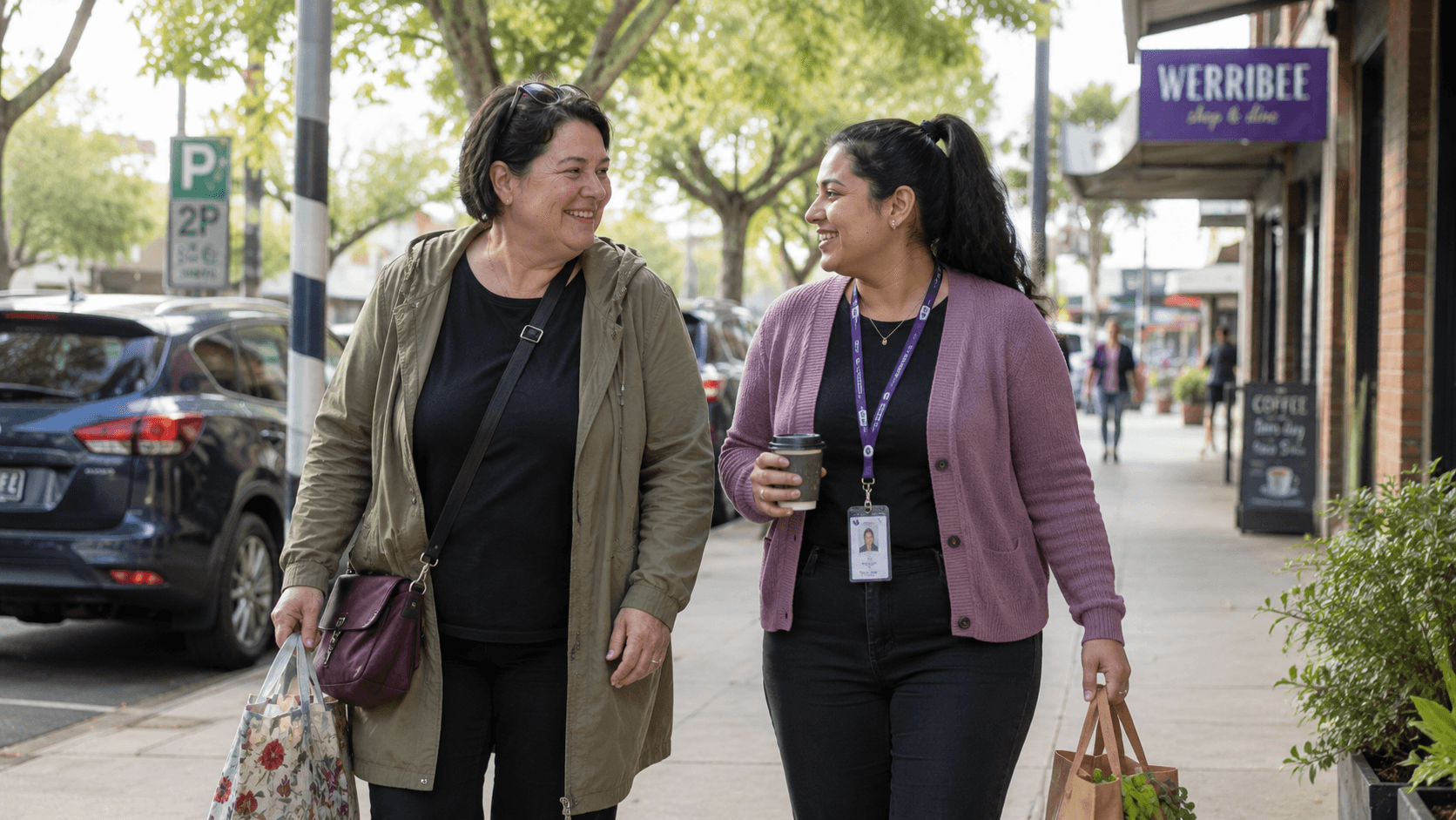 A support worker and participant walking together in Werribee